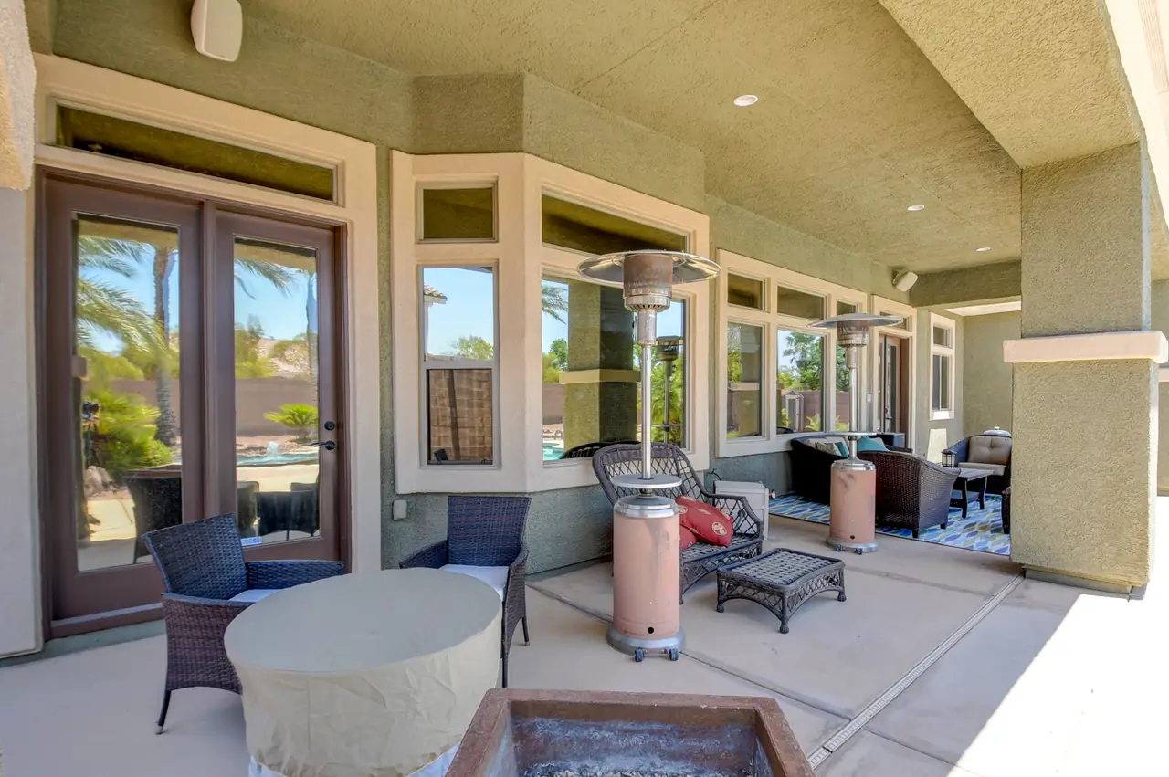 Covered patio along the back of the house with patio heaters