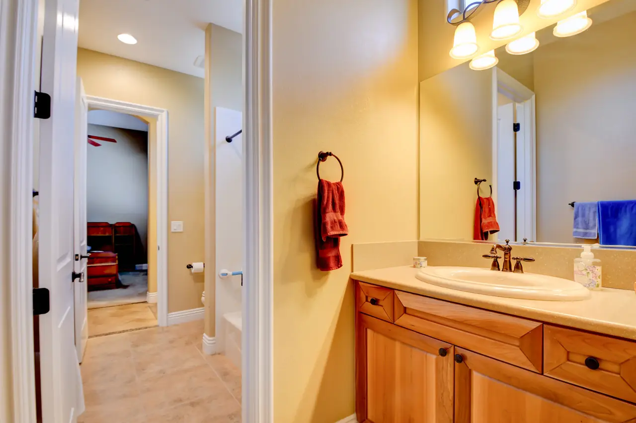 Bathroom vanity connecting two bedrooms