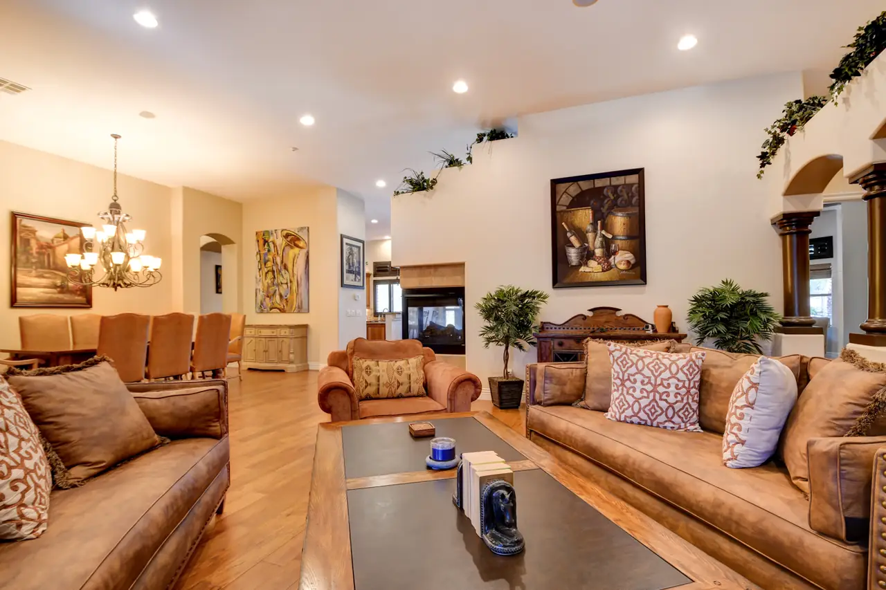 Living room with a high ceiling looking toward the formal dining room