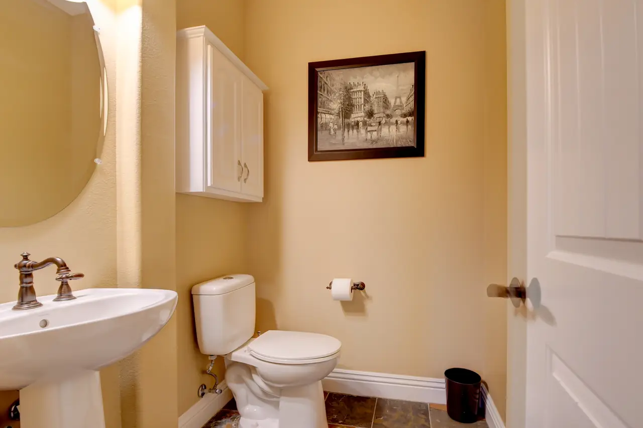 Powder room with a pedestal sink